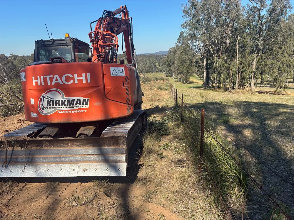 Kirkman excavator beside a freshly cleared fence line
