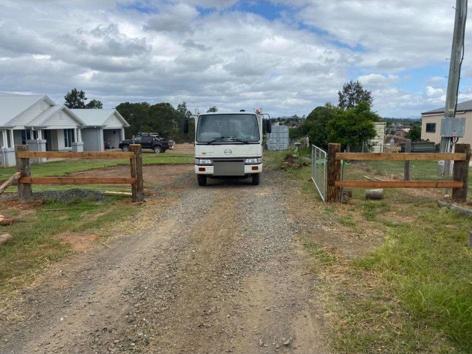 Post and rail entry posts at a new driveway